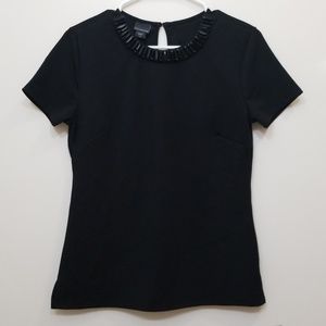 Black shirt with a jewel collar